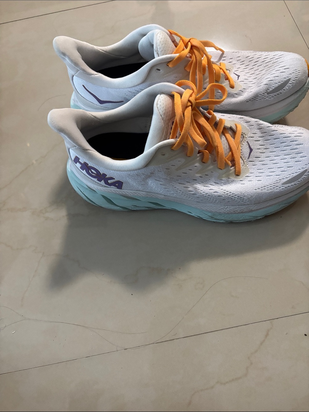 Hoka Women's White Running Shoes with Mint Midsole and Orange Laces